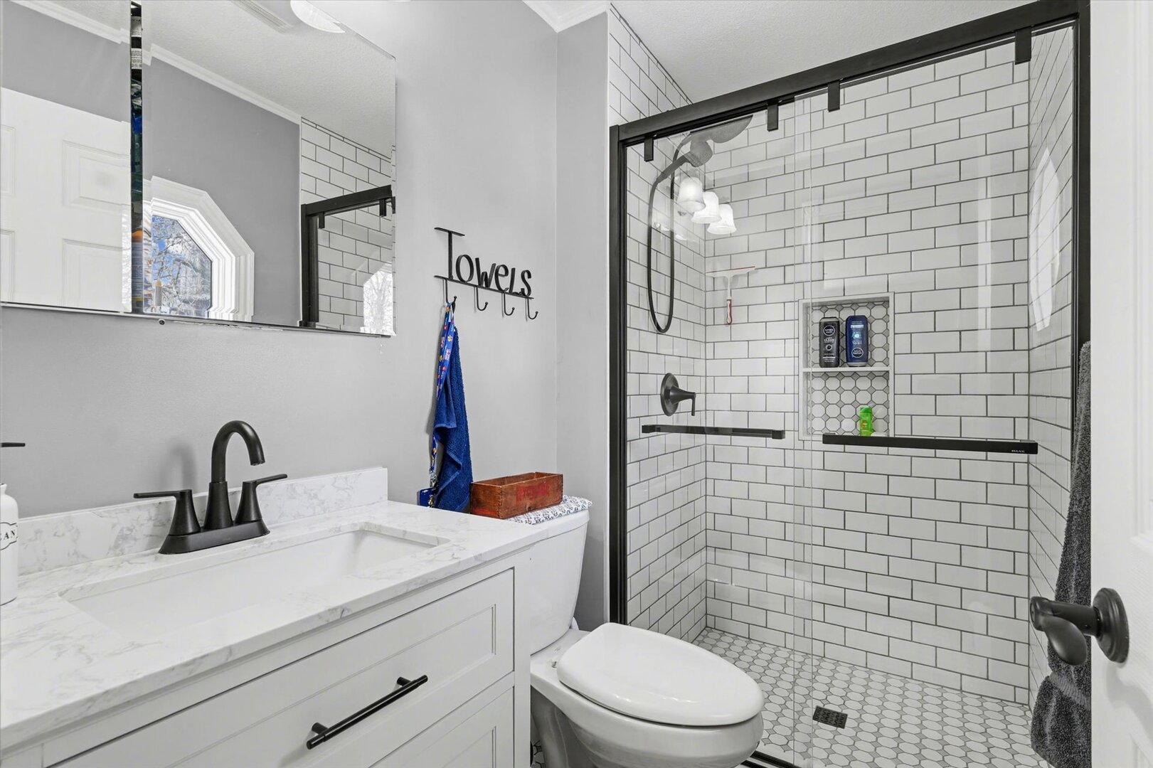 808 South Spring Lake Road Mahomet, IL 61853 - Photo 24 of 37 a bathroom with a sink a toilet and shower