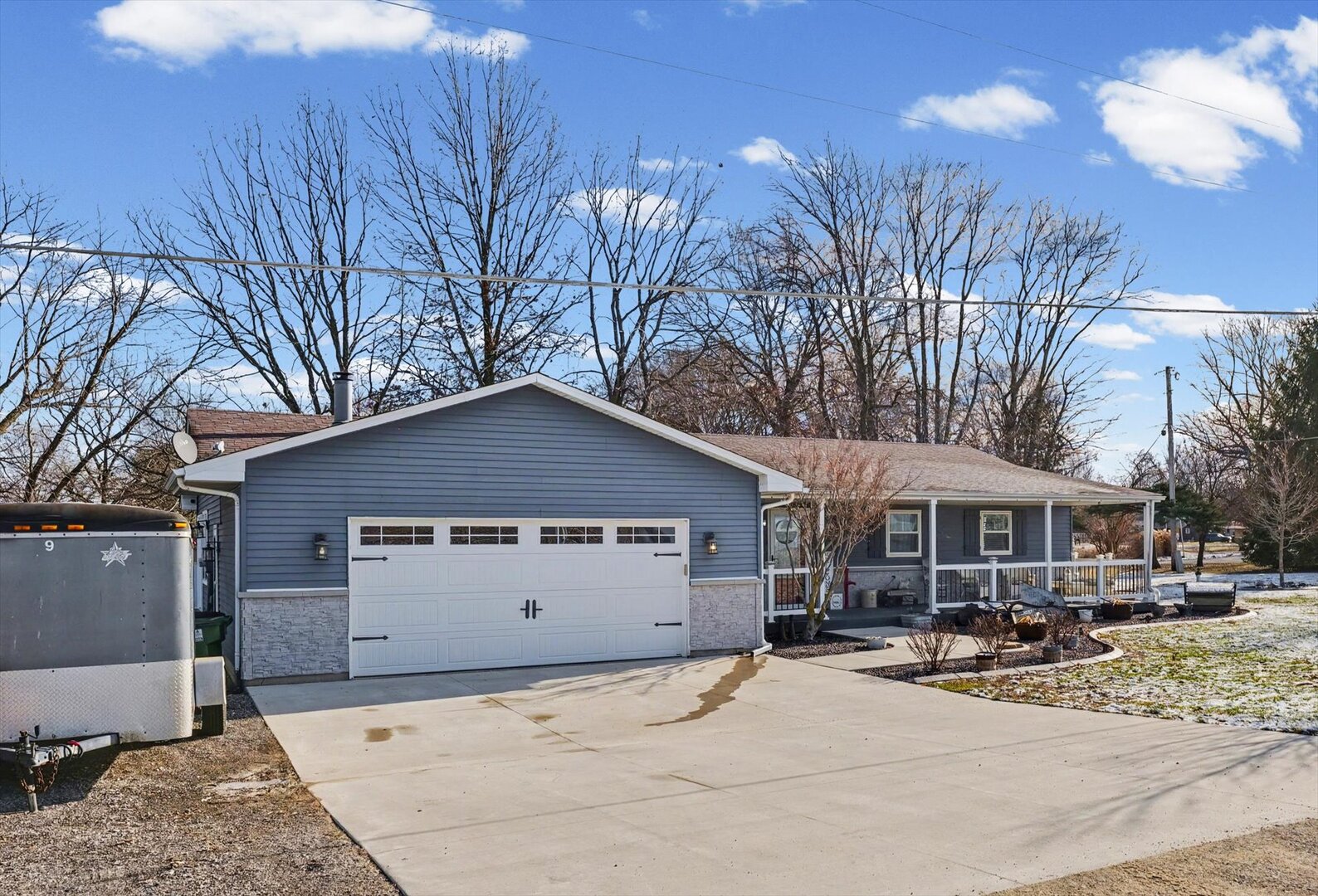 808 South Spring Lake Road Mahomet, IL 61853 - Photo 3 of 37 a front view of a house with basket ball court and chairs