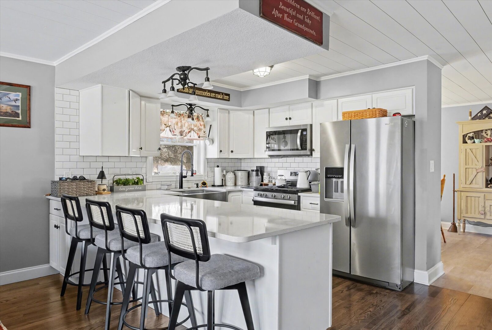 808 South Spring Lake Road Mahomet, IL 61853 - Photo 10 of 37 a kitchen with refrigerator cabinets dining table and chairs