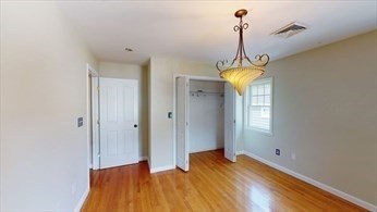 8 Brandley Road, Unit SF Watertown, MA 02472 - Photo 12 of 25 a view of a room with window and wooden floor