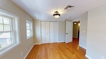 8 Brandley Road, Unit SF Watertown, MA 02472 - Photo 14 of 25 wooden floor in an empty room with a window