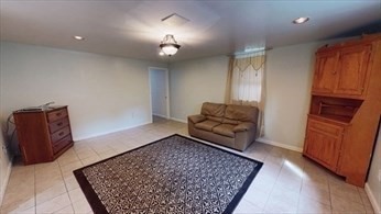 8 Brandley Road, Unit SF Watertown, MA 02472 - Photo 21 of 25 wooden floor in an empty room with a couch