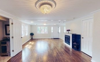 8 Brandley Road, Unit SF Watertown, MA 02472 - Photo 7 of 25 a view of an empty room with wooden floor and a window