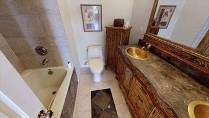 8 Brandley Road, Unit SF Watertown, MA 02472 - Photo 9 of 25 a bathroom with a tub sink and mirror