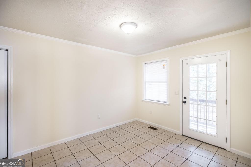 411 Cypress Drive Dublin, GA 31021 - Photo 11 of 31 an empty room with windows
