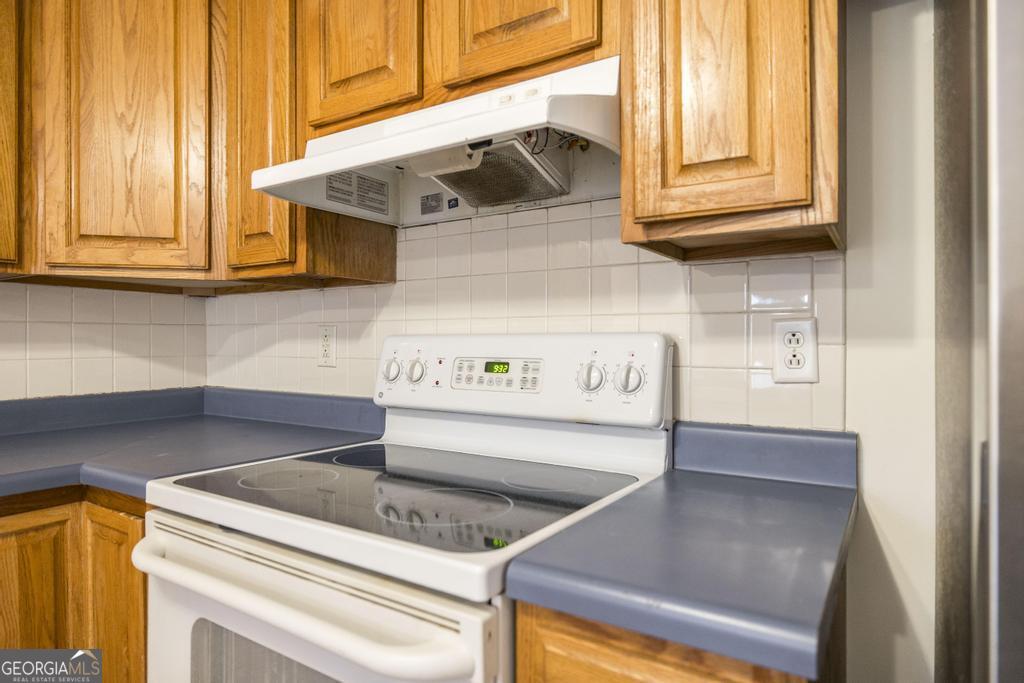 411 Cypress Drive Dublin, GA 31021 - Photo 14 of 31 a kitchen with a stove and a microwave