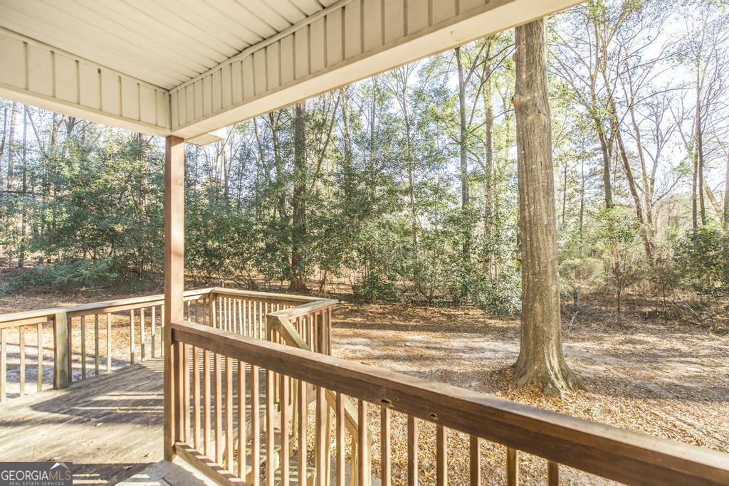 411 Cypress Drive Dublin, GA 31021 - Photo 27 of 31 a view of a glass door with a trees from a window