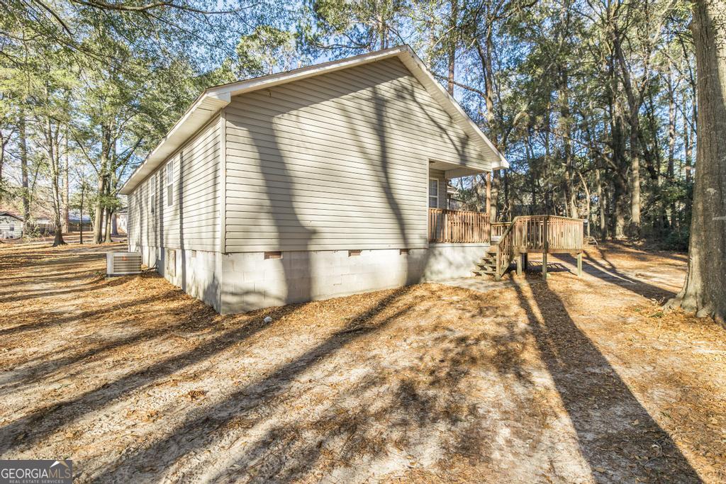 411 Cypress Drive Dublin, GA 31021 - Photo 28 of 31 a view of a house with a yard