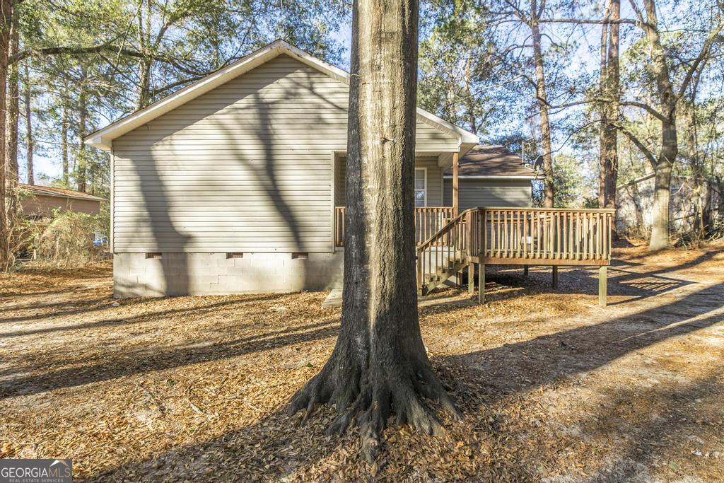 411 Cypress Drive Dublin, GA 31021 - Photo 29 of 31 a view of a house with a yard