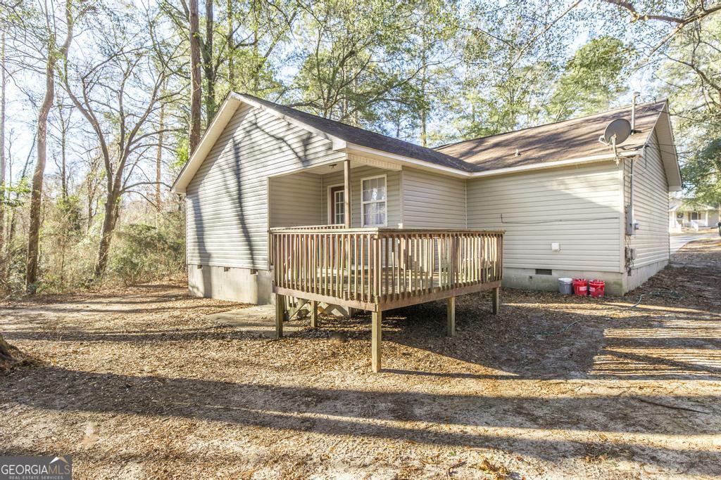 411 Cypress Drive Dublin, GA 31021 - Photo 30 of 31 a backyard of a house with trampoline
