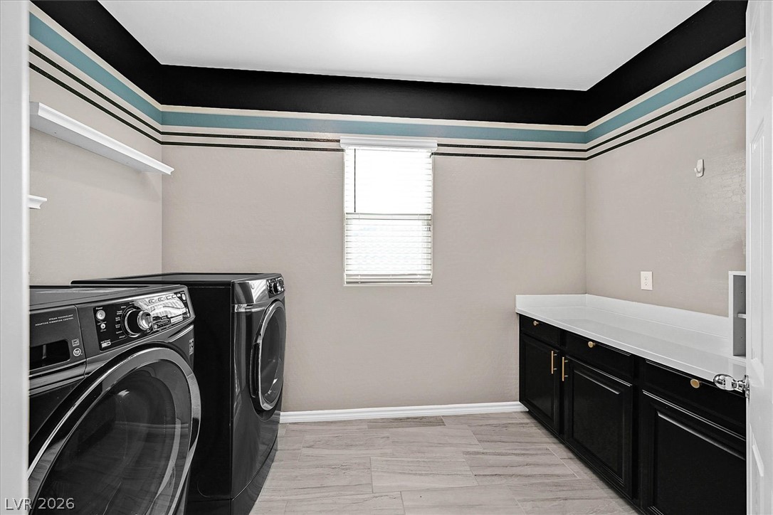 1106 Langston Ranch Avenue Henderson, NV 89002 - Photo 26 of 36 Functional laundry room featuring a washer, dryer, and built-in cabinetry with counter space for everyday tasks.