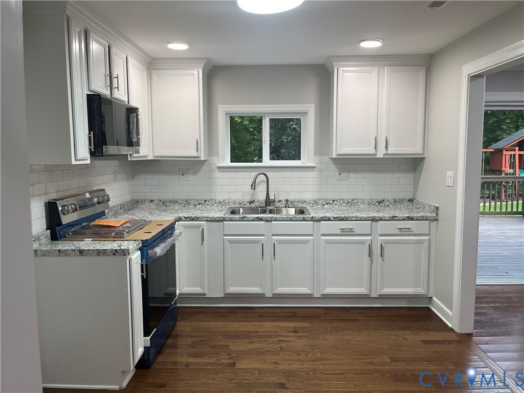 3074 Rocky Ford Road Crewe, VA 23930 - Photo 14 of 48 Kitchen featuring white shaker cabinetry, speckled