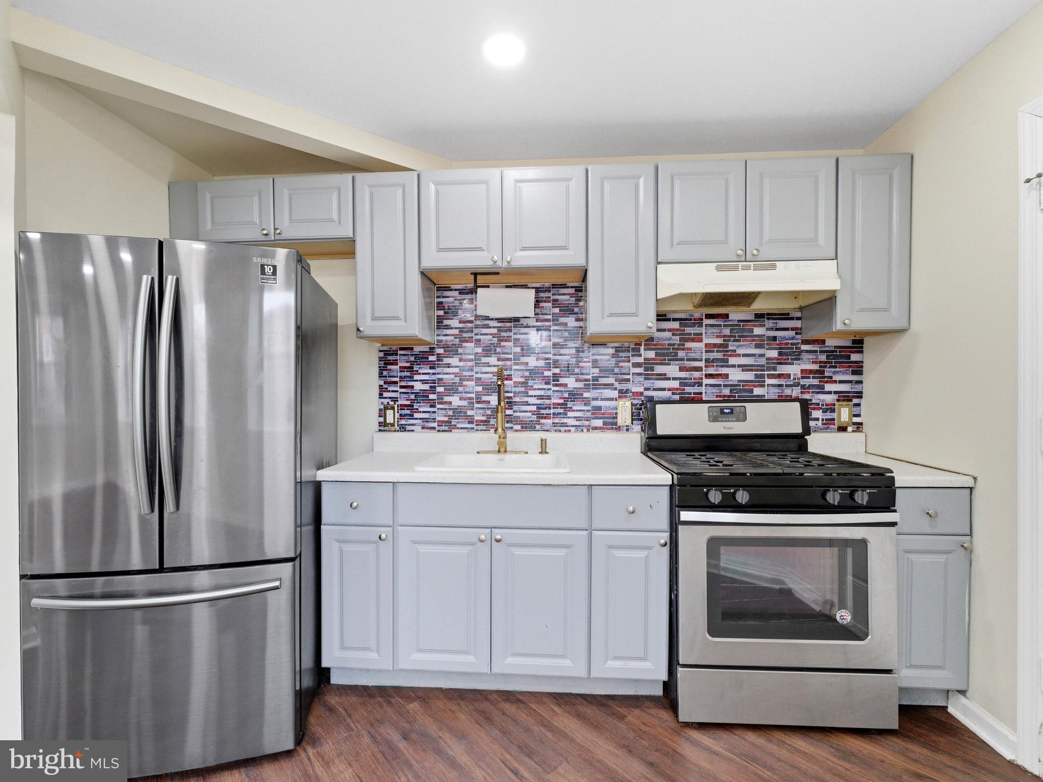 2976 North Congress Road Camden, NJ 08104 - Photo 13 of 25 a kitchen with appliances a refrigerator and cabinets