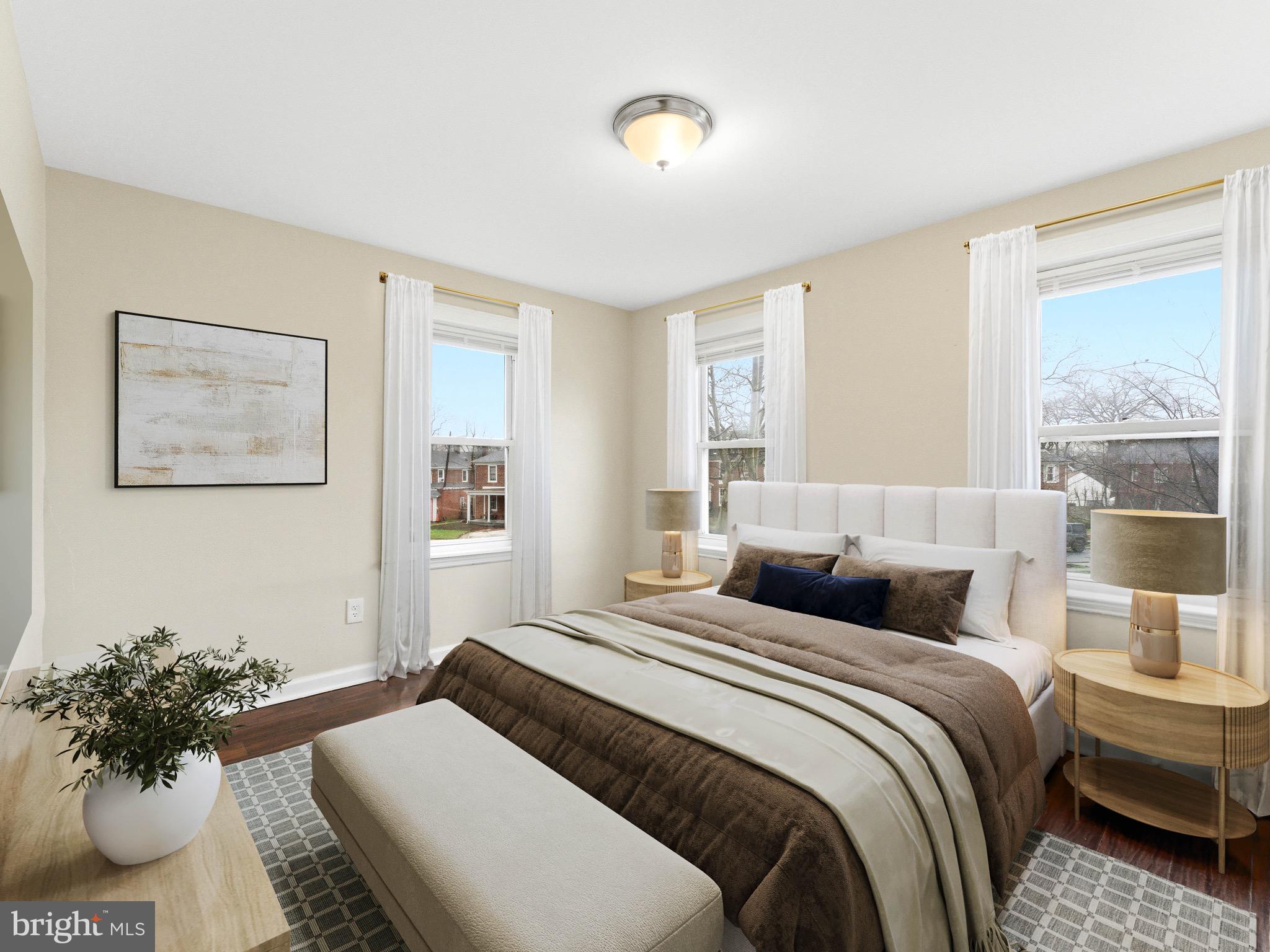 2976 North Congress Road Camden, NJ 08104 - Photo 14 of 25 a bedroom with a bed and a potted plant