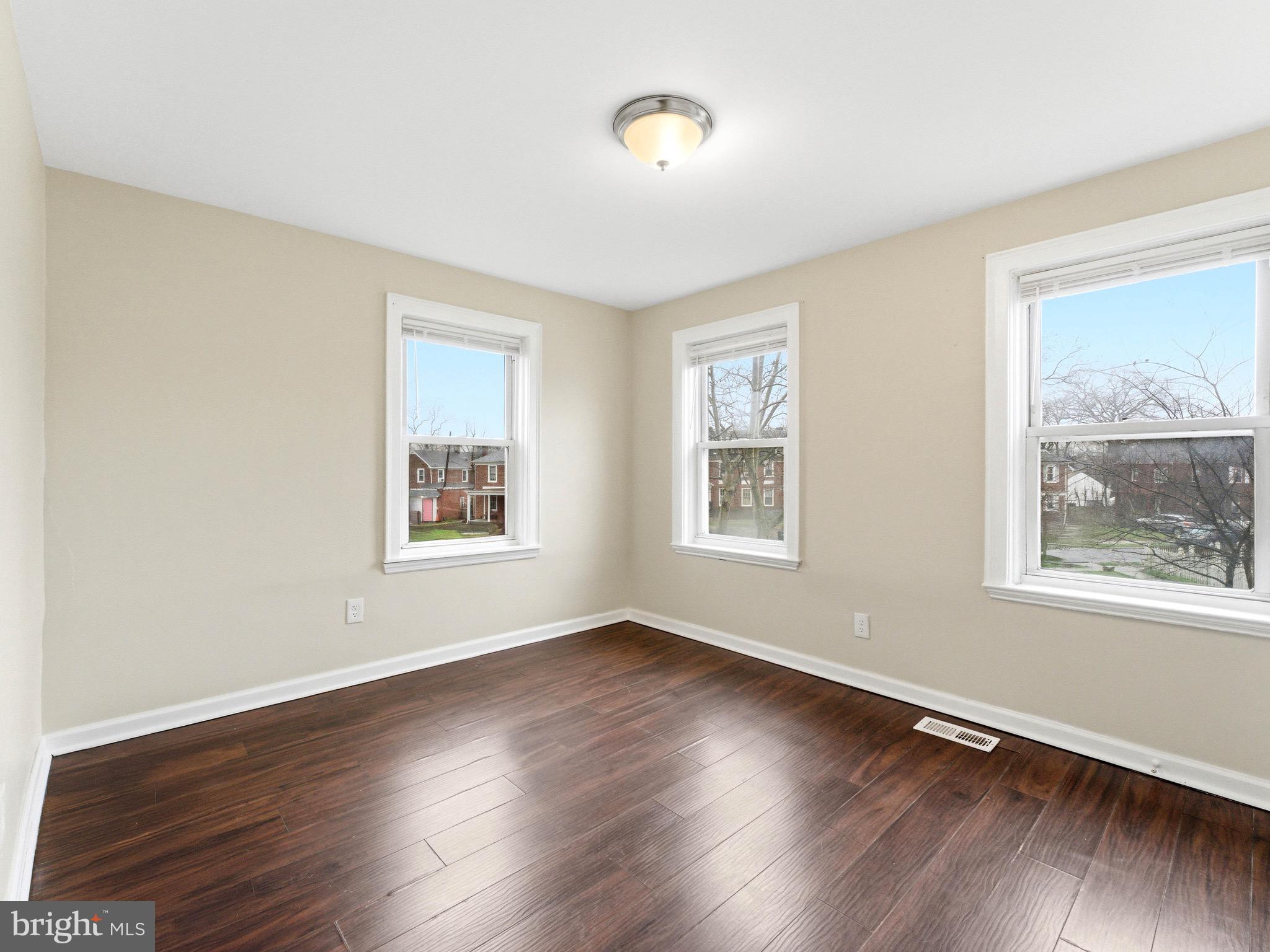 2976 North Congress Road Camden, NJ 08104 - Photo 15 of 25 a view of an empty room with wooden floor and a window