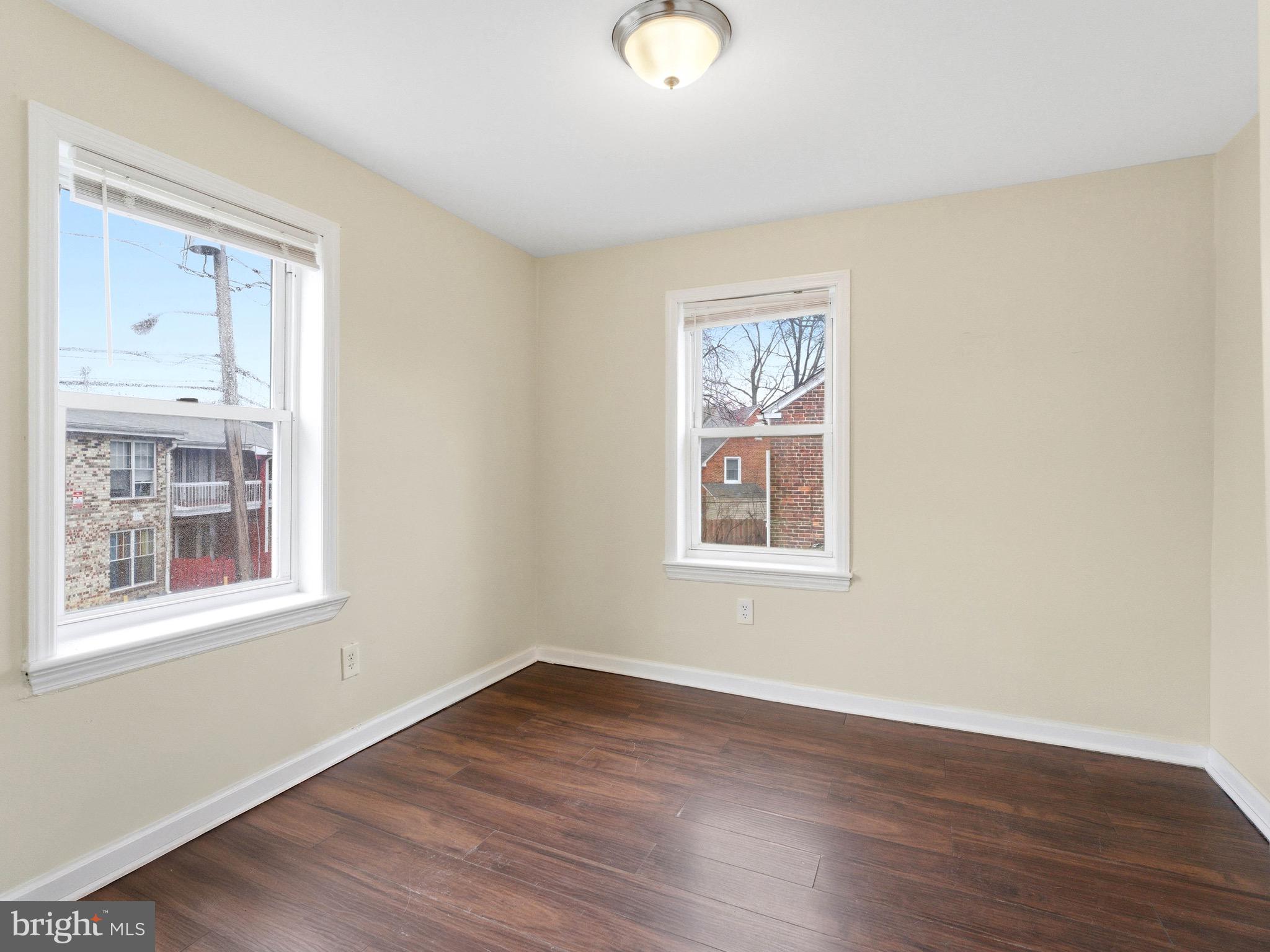 2976 North Congress Road Camden, NJ 08104 - Photo 20 of 25 a view of an empty room with wooden floor and a window