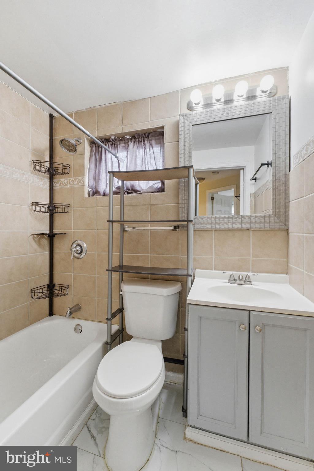 2976 North Congress Road Camden, NJ 08104 - Photo 22 of 25 a bathroom with a sink a toilet and shower