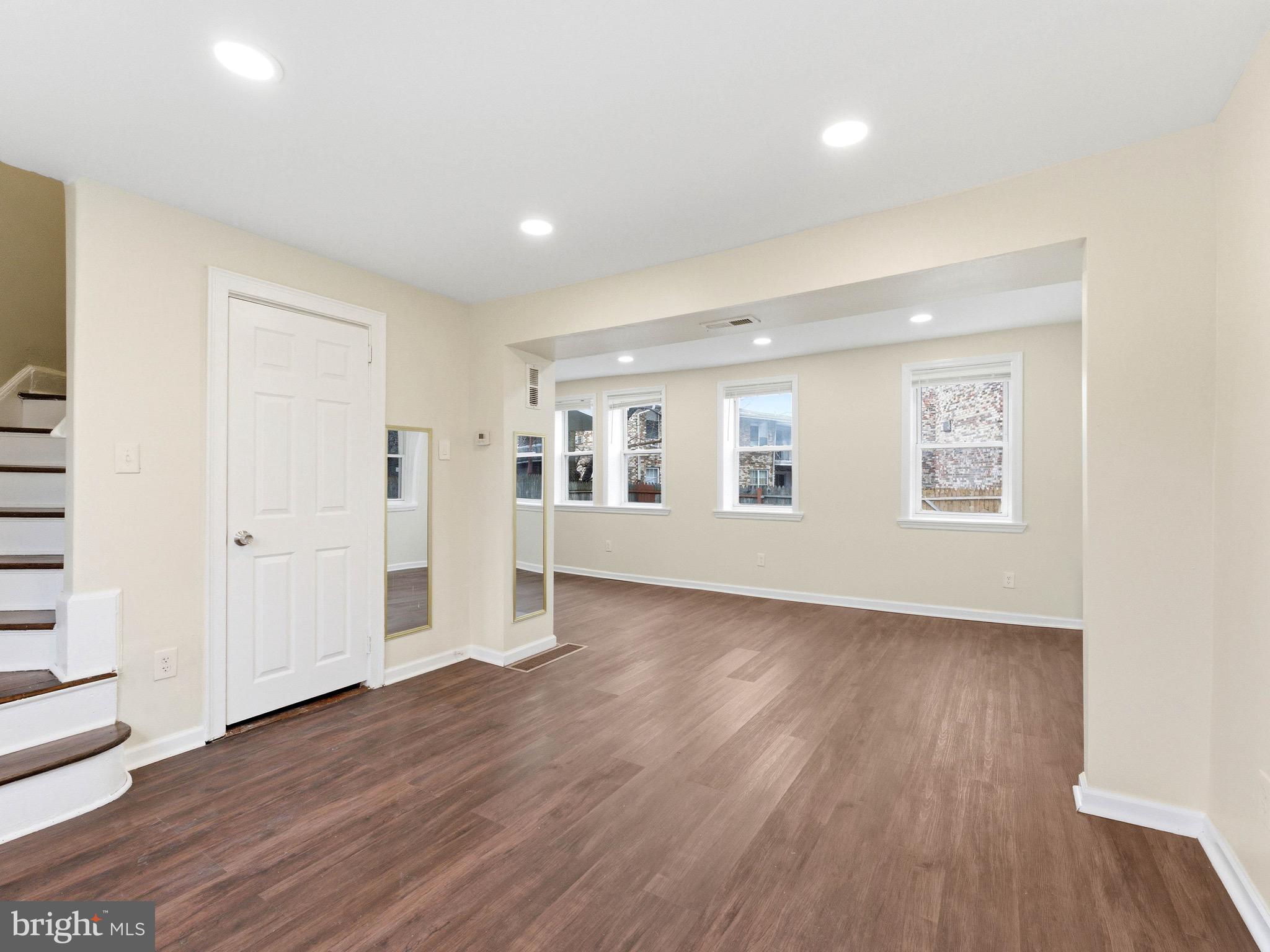 2976 North Congress Road Camden, NJ 08104 - Photo 4 of 25 an empty room with wooden floor and white walls