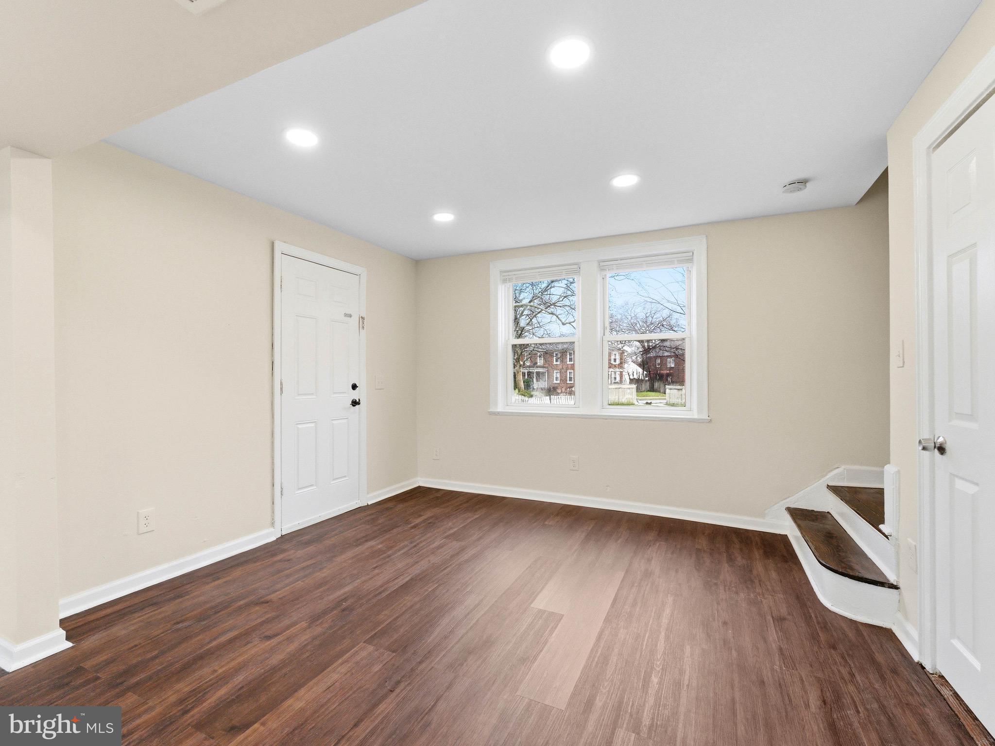 2976 North Congress Road Camden, NJ 08104 - Photo 5 of 25 a view of an empty room with wooden floor and a window