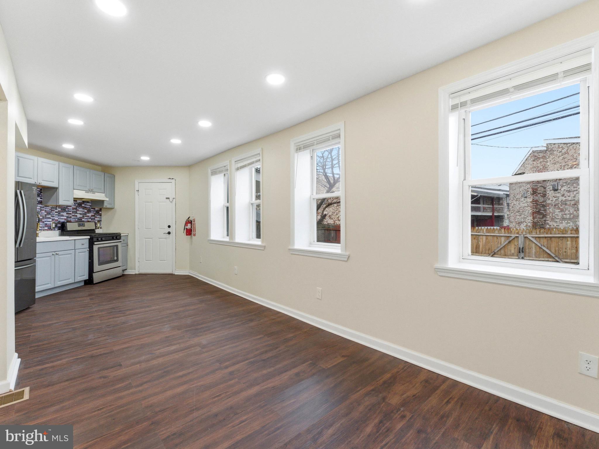 2976 North Congress Road Camden, NJ 08104 - Photo 7 of 25 a view of an empty room with wooden floor and a window