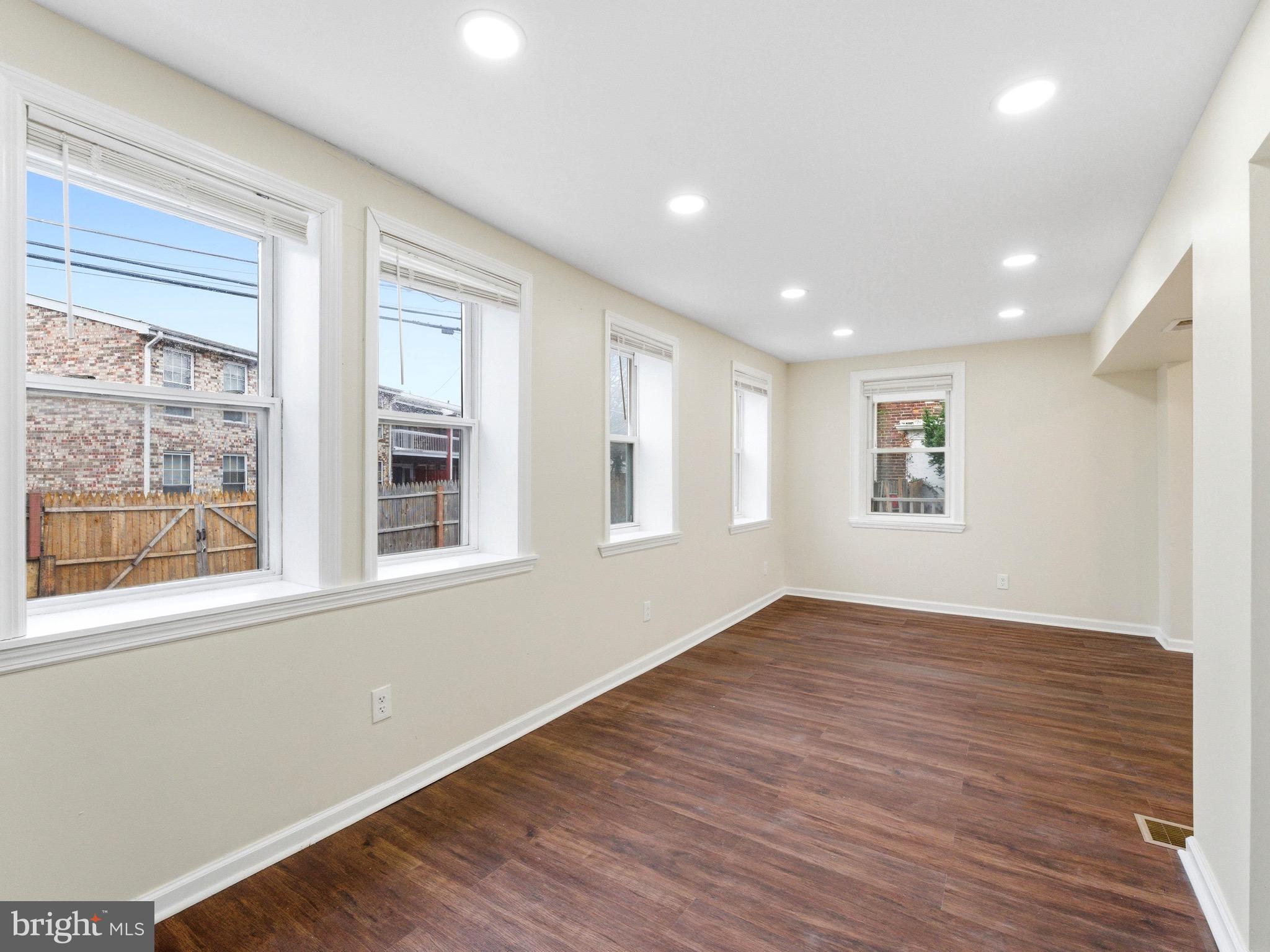 2976 North Congress Road Camden, NJ 08104 - Photo 10 of 25 a view of an empty room with wooden floor and a window