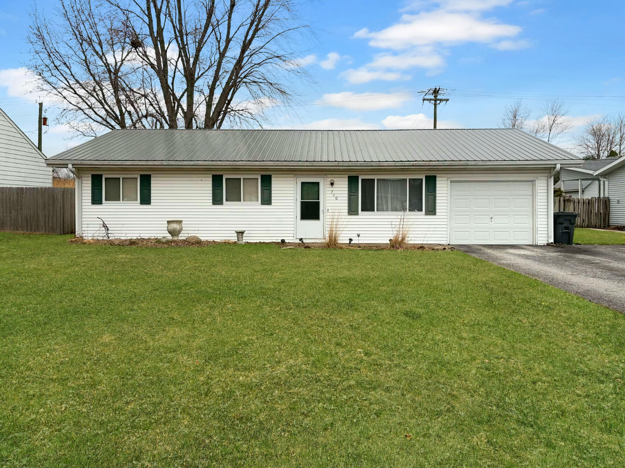710 West Charles Street Rensselaer, IN 47978 - Photo 1 of 16 a front view of a house with a yard and garage