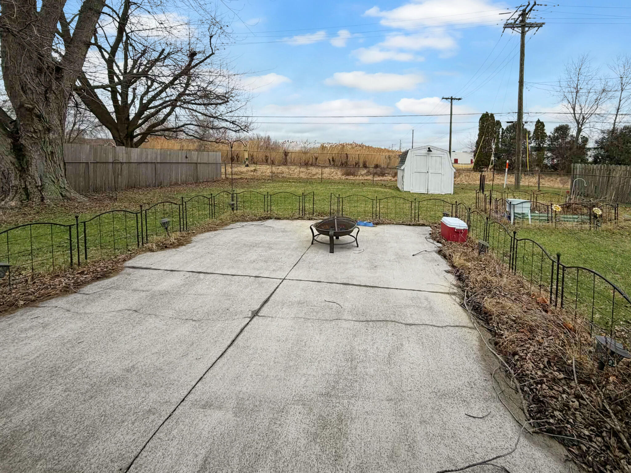 710 West Charles Street Rensselaer, IN 47978 - Photo 3 of 16 a backyard view of a house with basket ball court