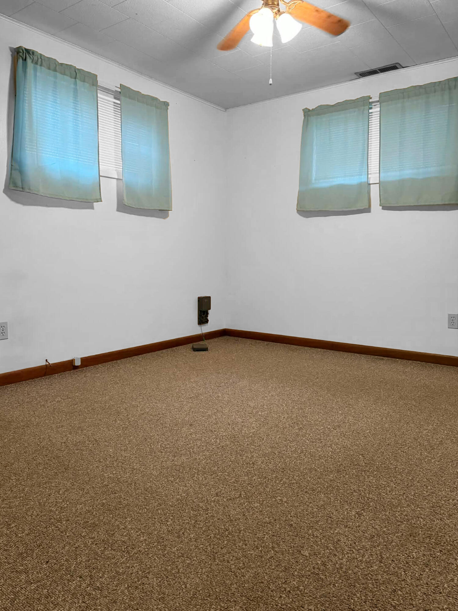 710 West Charles Street Rensselaer, IN 47978 - Photo 10 of 16 an empty room with a fan