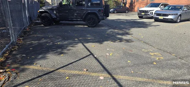 a sign board with yard in front of it