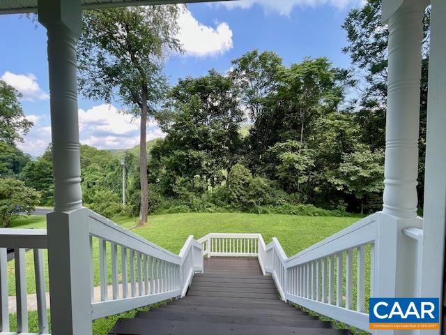 5420 Cove Garden Road Covesville, VA 22931 - Photo 3 of 27 a view of a wooden deck and a garden
