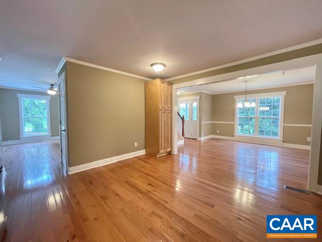 5420 Cove Garden Road Covesville, VA 22931 - Photo 9 of 27 a view of an empty room with wooden floor and a window