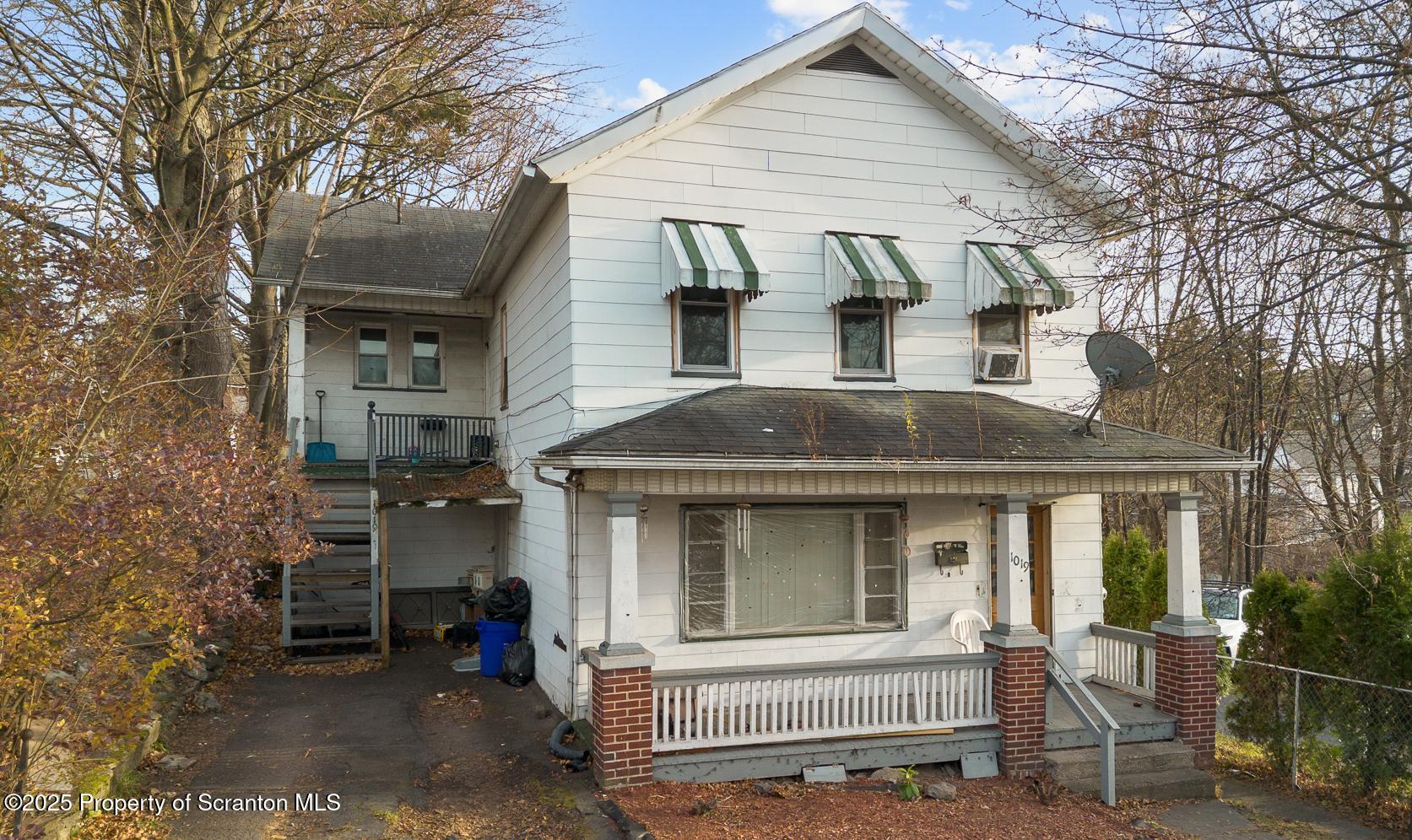 a front view of a house with a porch