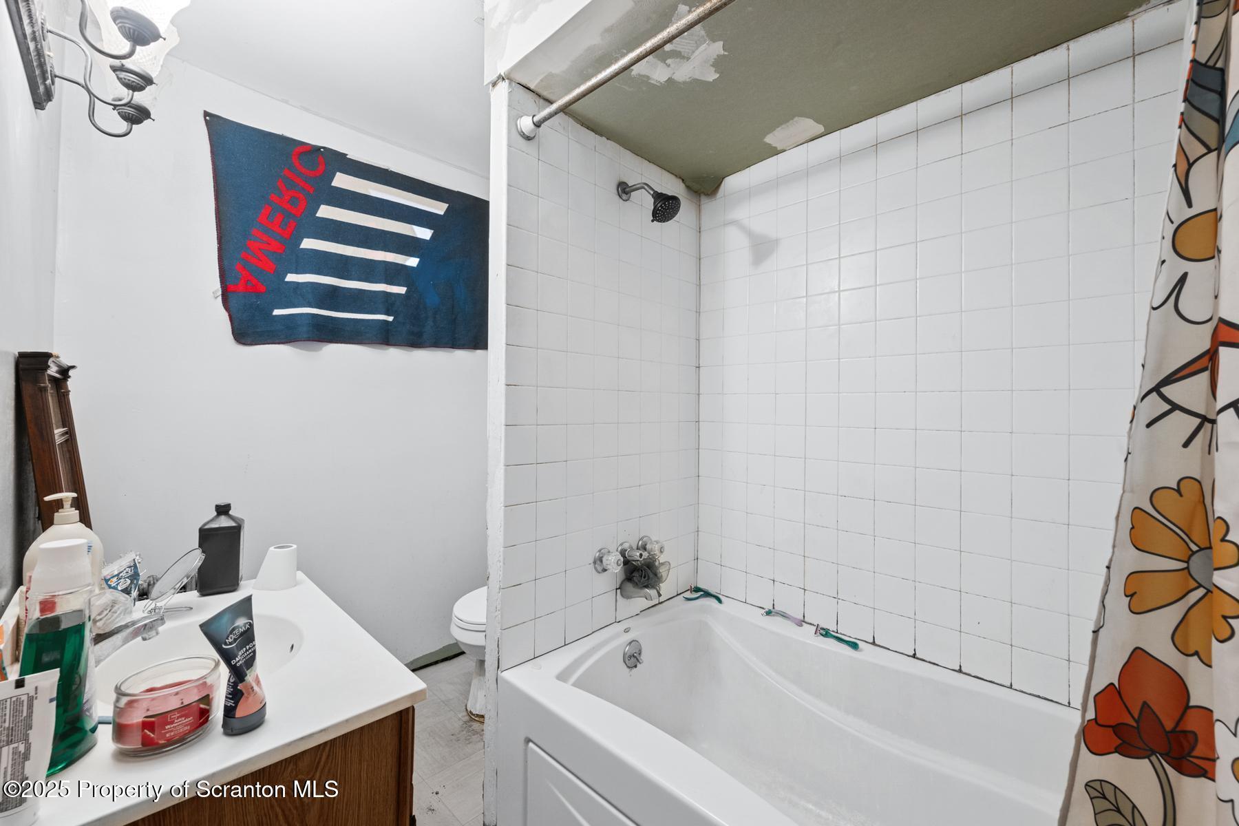 1019 South Webster Avenue Scranton, PA 18505 - Photo 12 of 36 a bathroom with a bathtub and sink