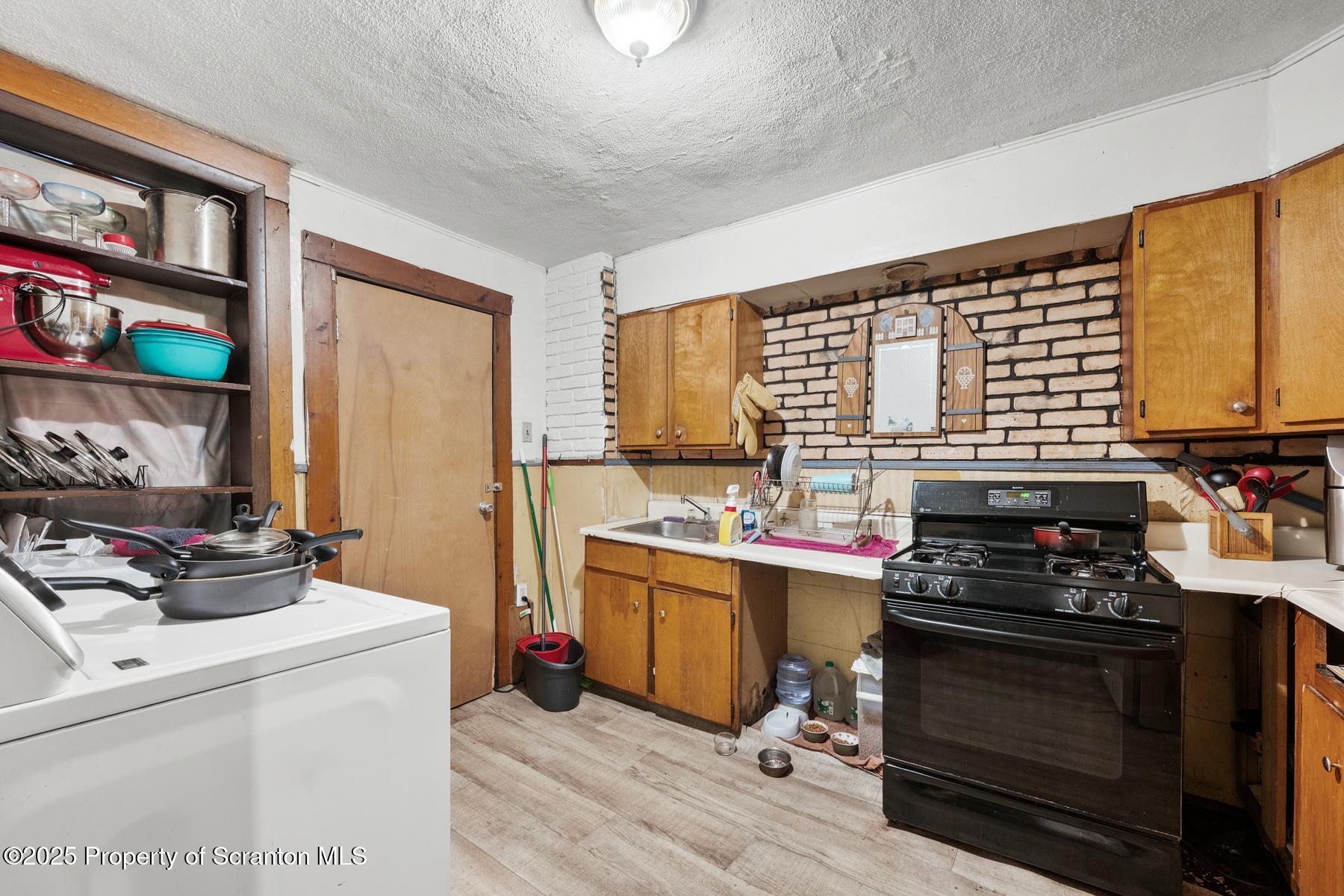 1019 South Webster Avenue Scranton, PA 18505 - Photo 14 of 36 a kitchen with a stove and a sink