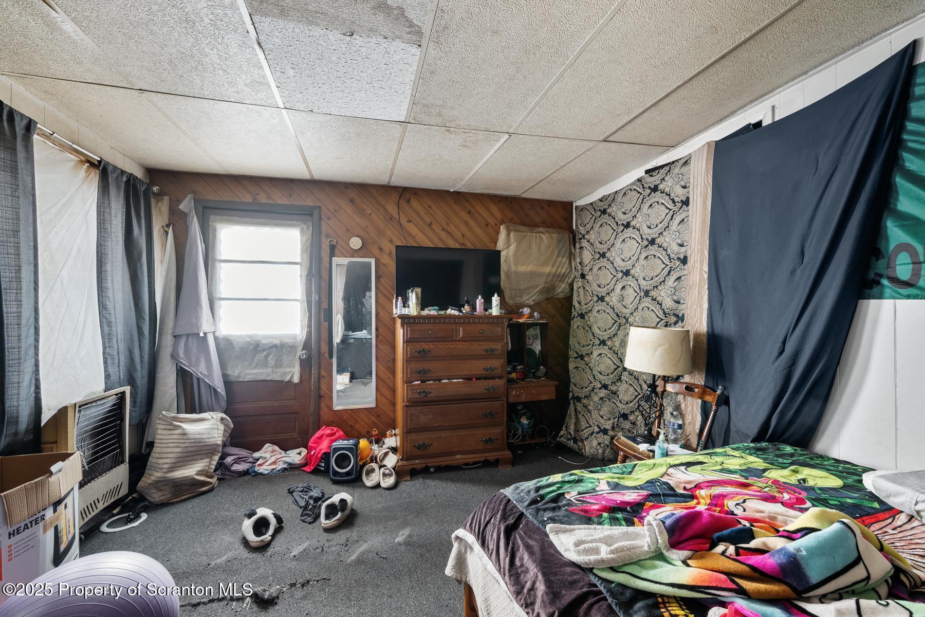 1019 South Webster Avenue Scranton, PA 18505 - Photo 16 of 36 a bedroom with furniture and a flat screen tv