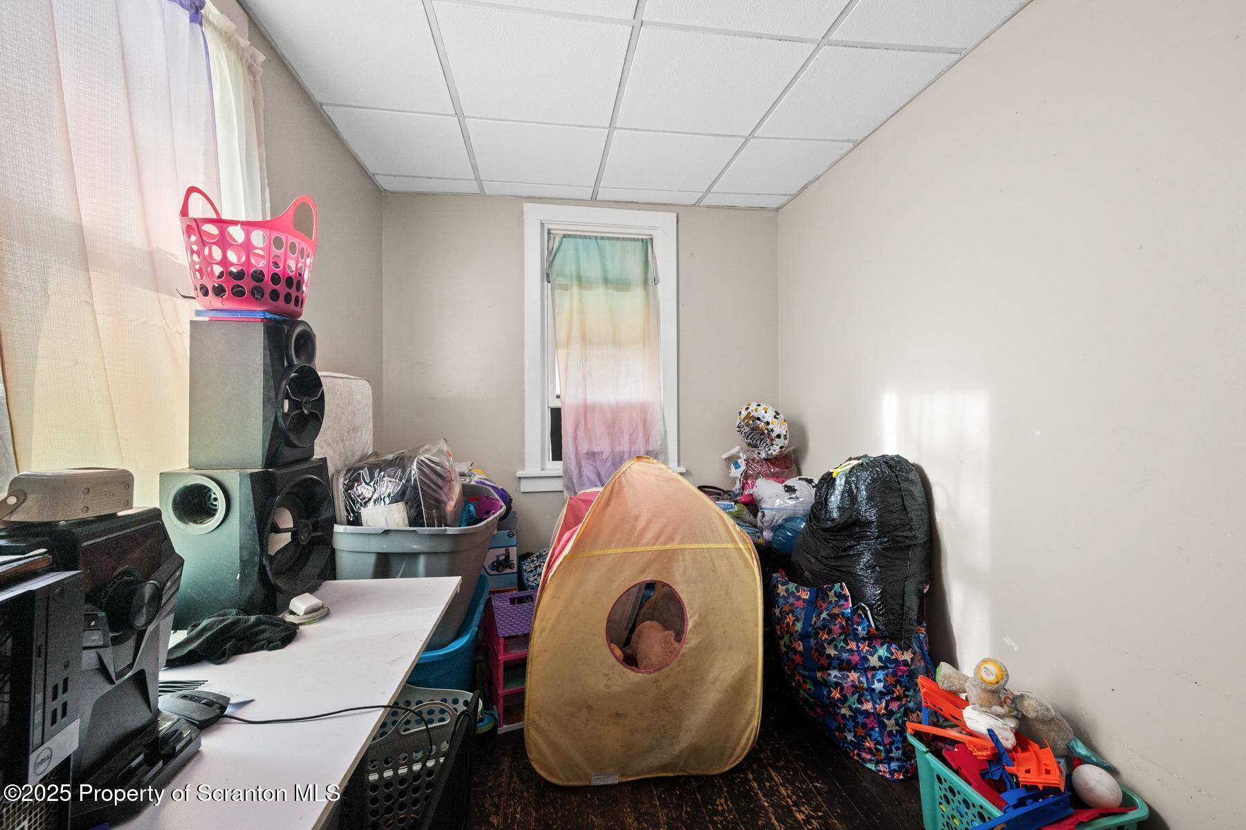 1019 South Webster Avenue Scranton, PA 18505 - Photo 22 of 36 a room with furniture a rug and a window