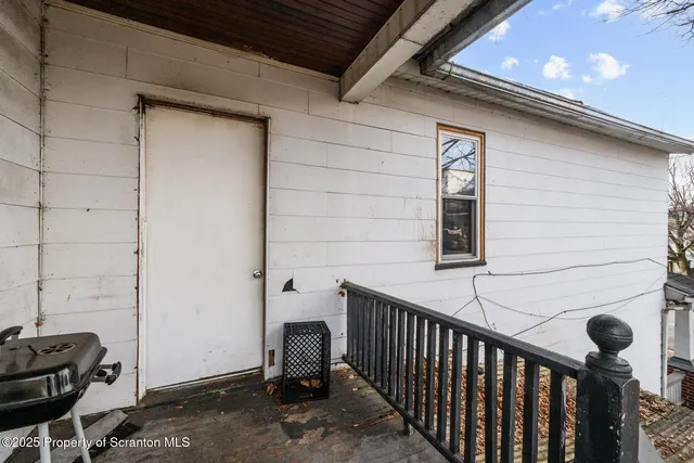 a view of a door and a window
