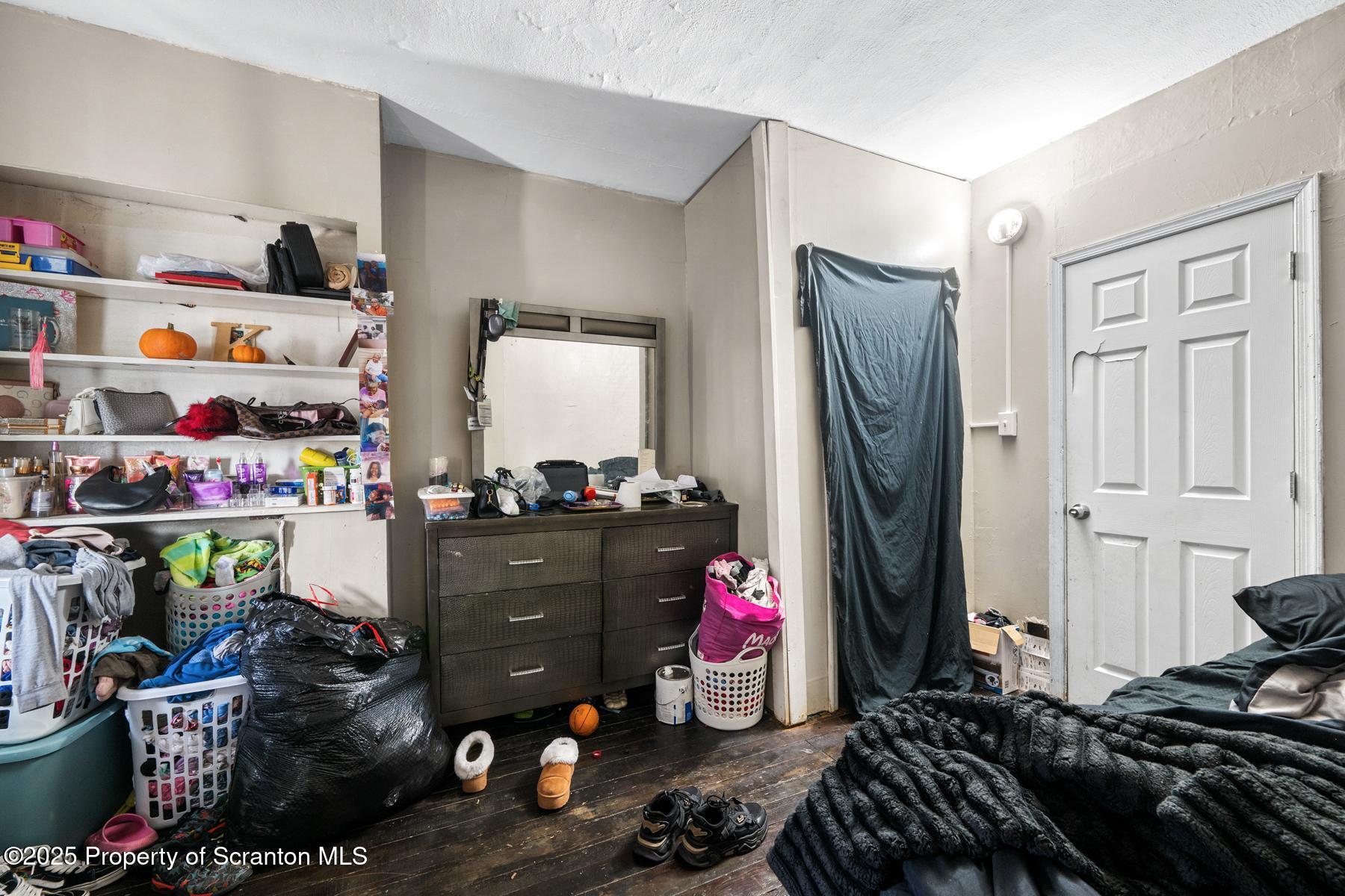 1019 South Webster Avenue Scranton, PA 18505 - Photo 29 of 36 a room with a refrigerator and a dresser