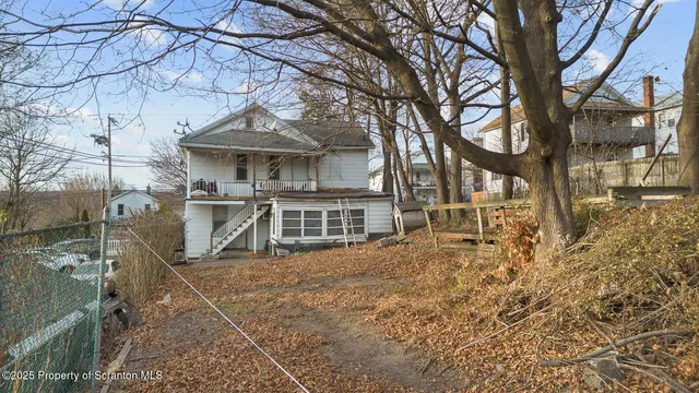 a house with trees in front of it