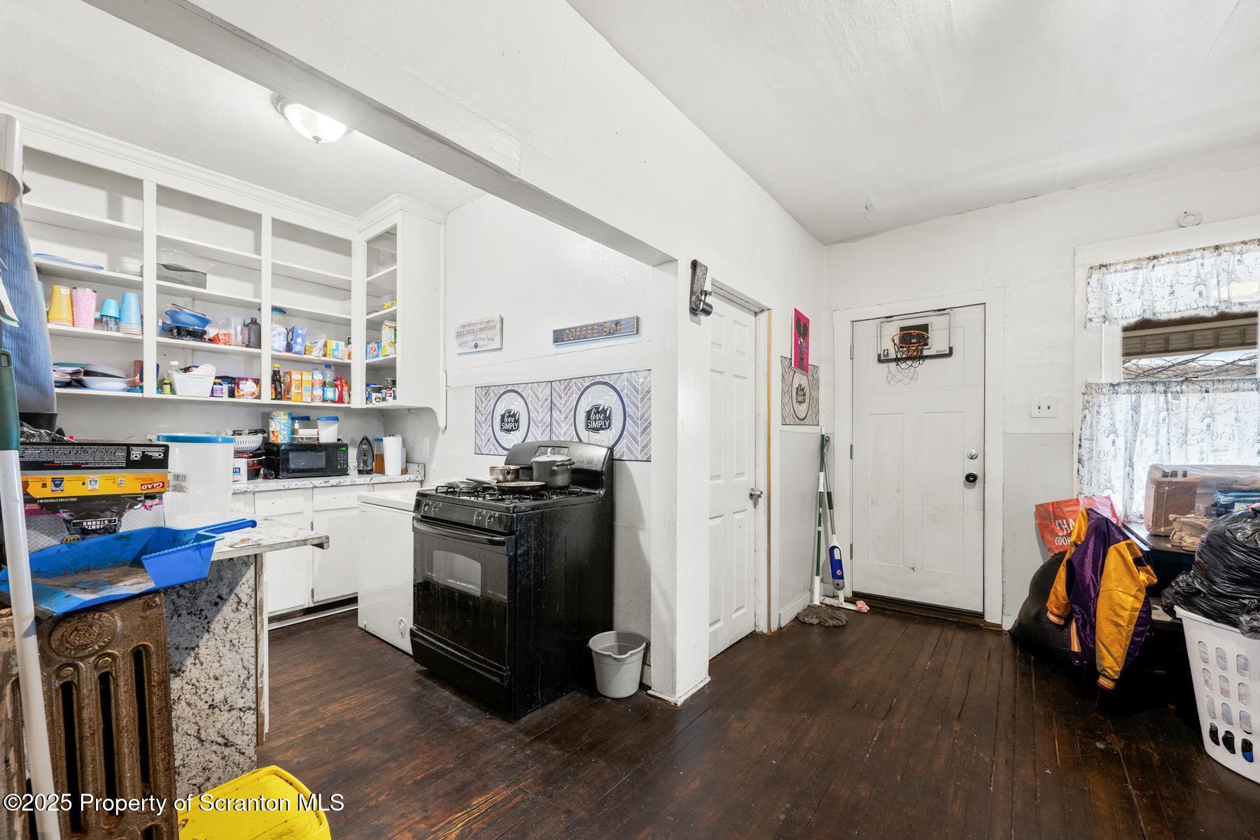 1019 South Webster Avenue Scranton, PA 18505 - Photo 32 of 36 a kitchen with stainless steel appliances and wooden floor