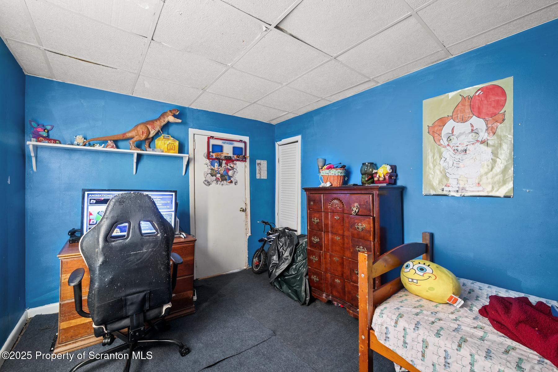 1019 South Webster Avenue Scranton, PA 18505 - Photo 35 of 36 a bedroom with a bed and wooden floor