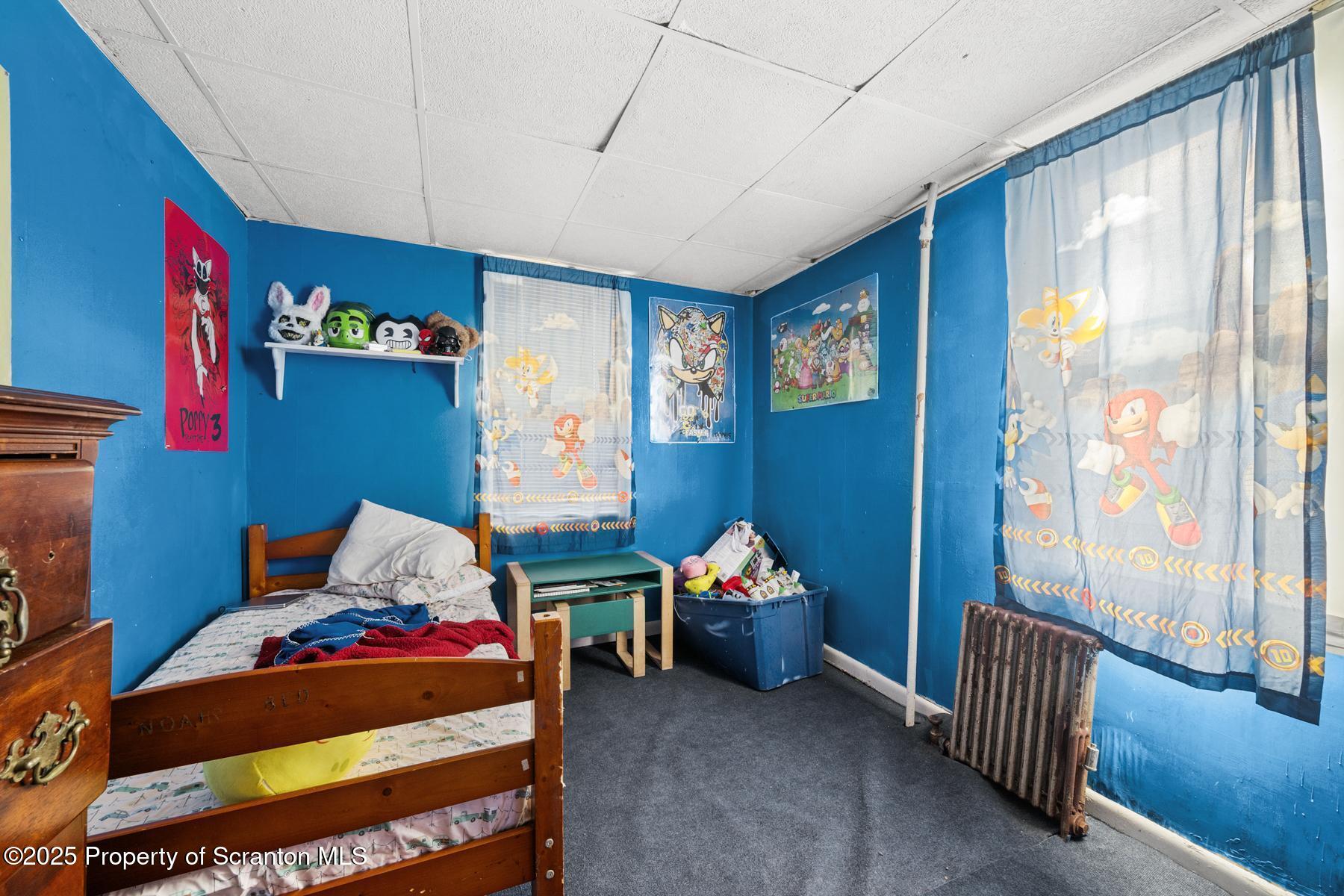 1019 South Webster Avenue Scranton, PA 18505 - Photo 36 of 36 a bedroom with a bed and a window