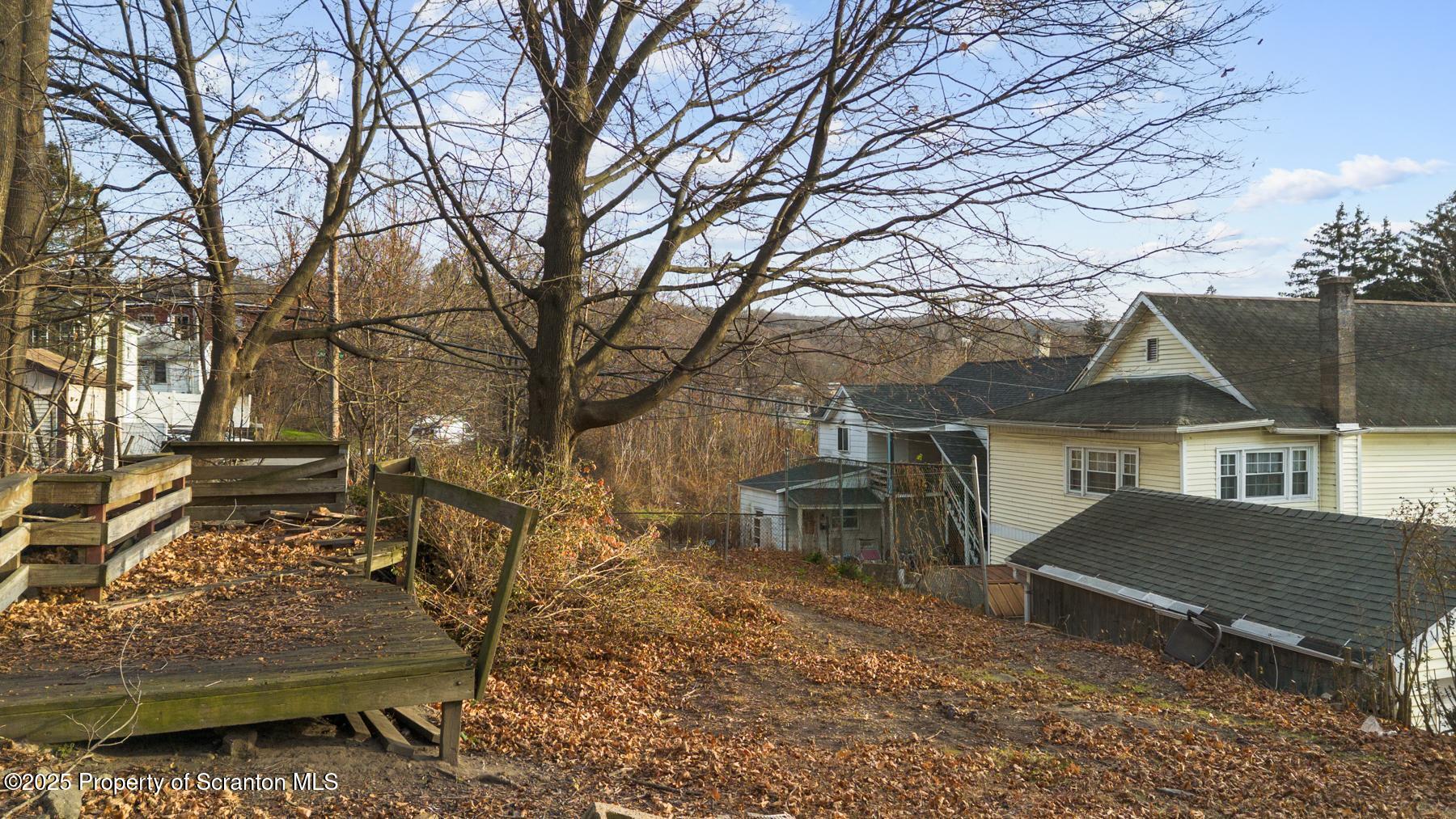 1019 South Webster Avenue Scranton, PA 18505 - Photo 4 of 36 a view of a house with a yard and sitting area