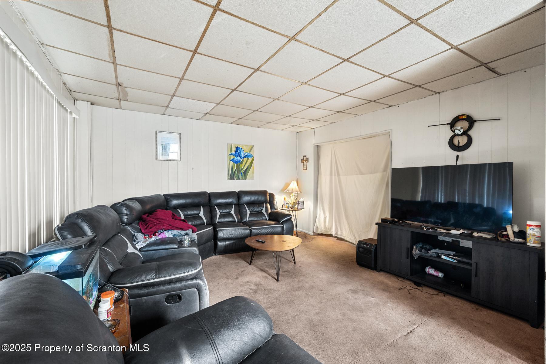 1019 South Webster Avenue Scranton, PA 18505 - Photo 6 of 36 a living room with furniture and a flat screen tv