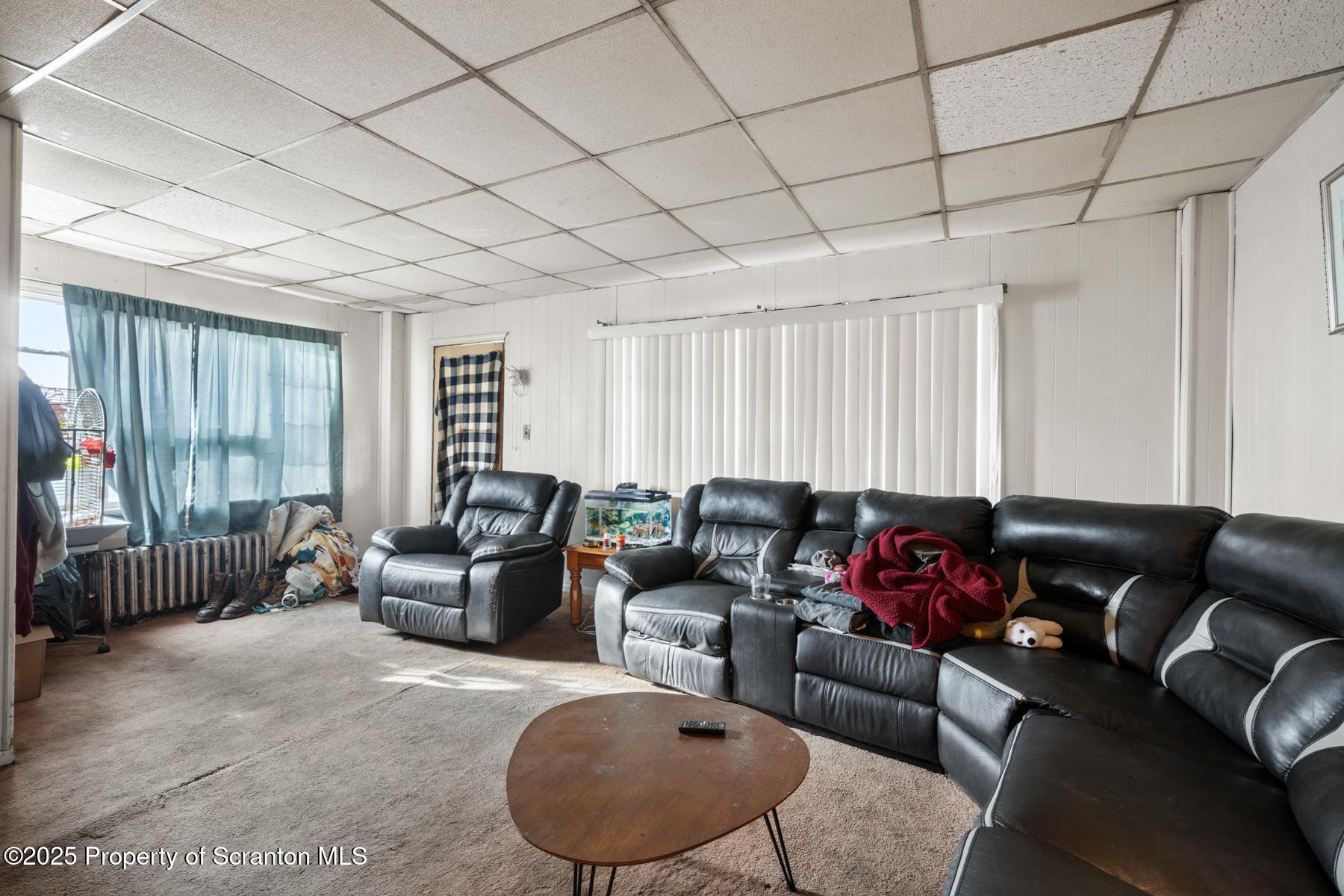 1019 South Webster Avenue Scranton, PA 18505 - Photo 7 of 36 a living room with furniture and a large window