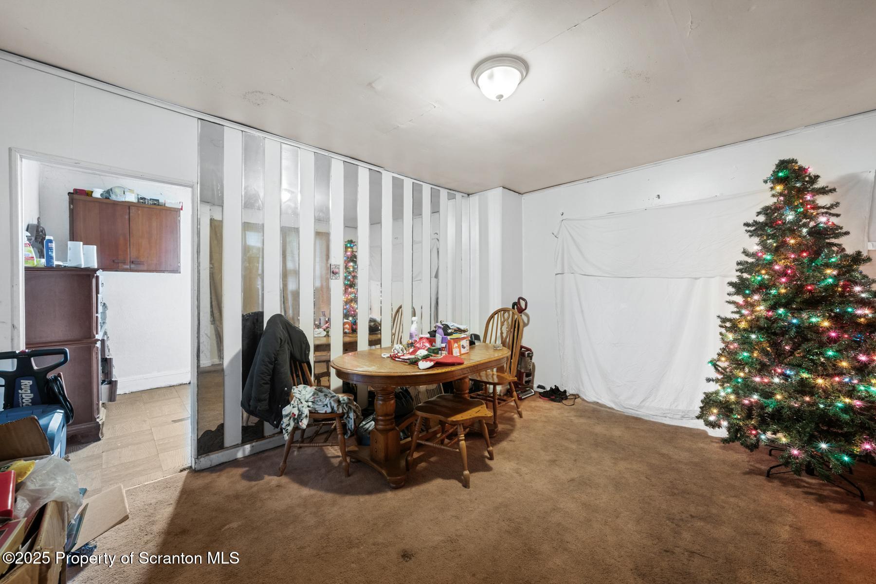 1019 South Webster Avenue Scranton, PA 18505 - Photo 8 of 36 a living room with furniture and a potted plant