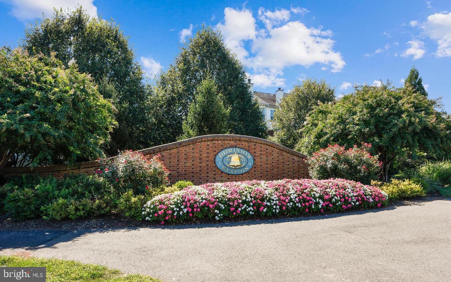 45460 Conductor Terrace, Unit 300 Sterling, VA 20166 - Photo 13 of 17 a view of a garden with flowers and trees