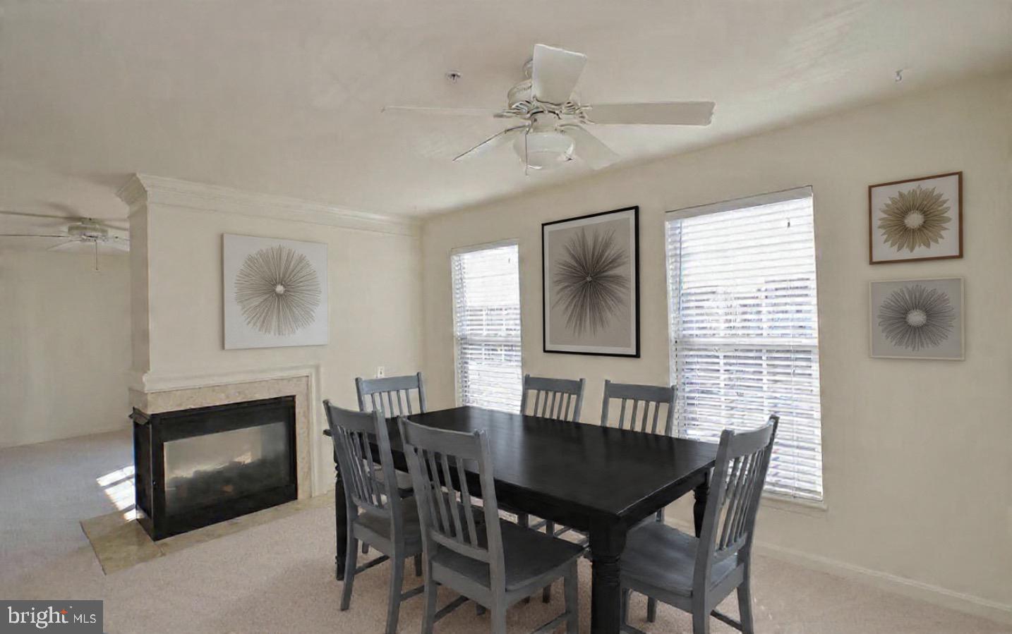45460 Conductor Terrace, Unit 300 Sterling, VA 20166 - Photo 2 of 17 a view of a dining room with furniture and a fireplace