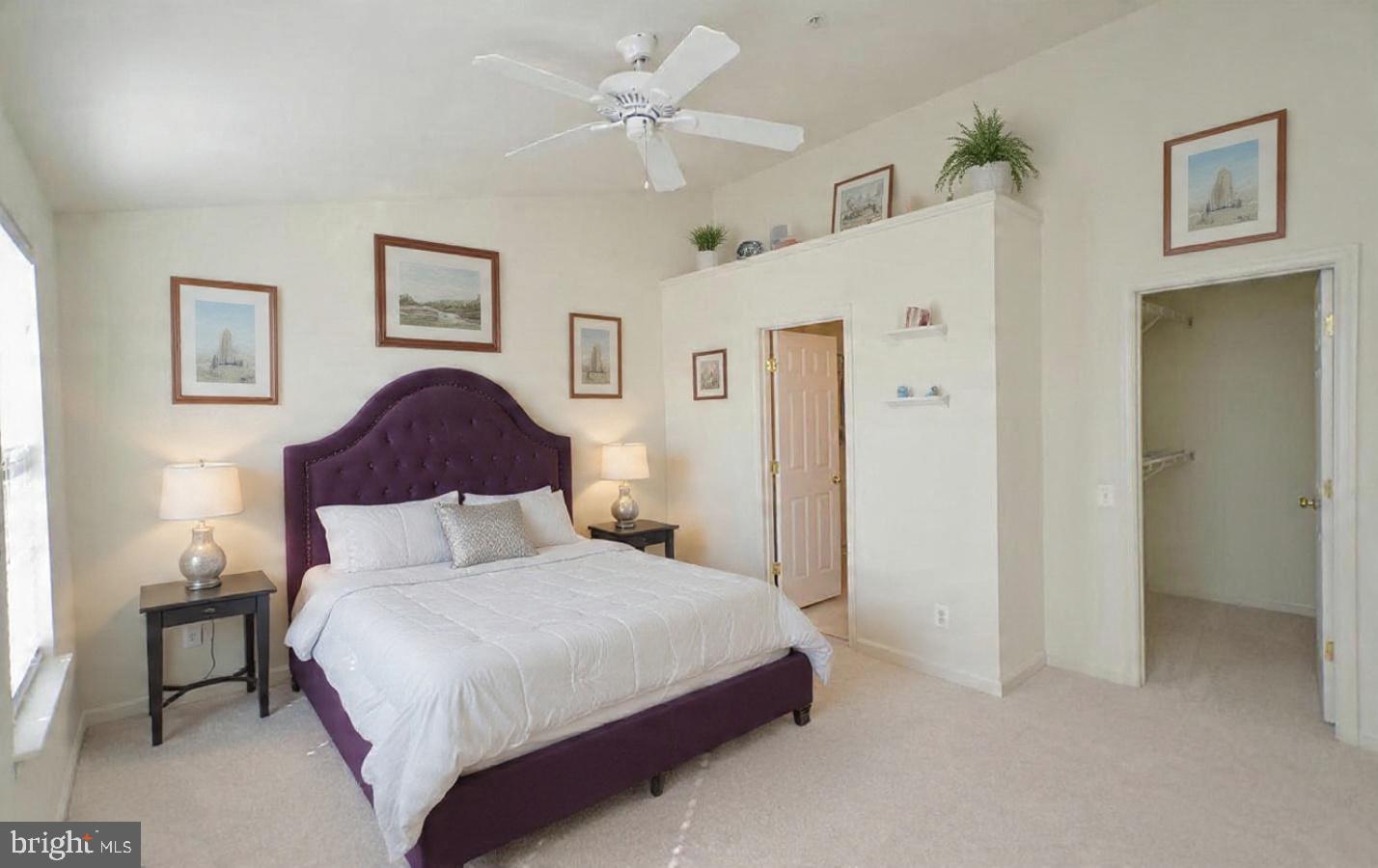 45460 Conductor Terrace, Unit 300 Sterling, VA 20166 - Photo 4 of 17 a bedroom with a large bed and a chandelier
