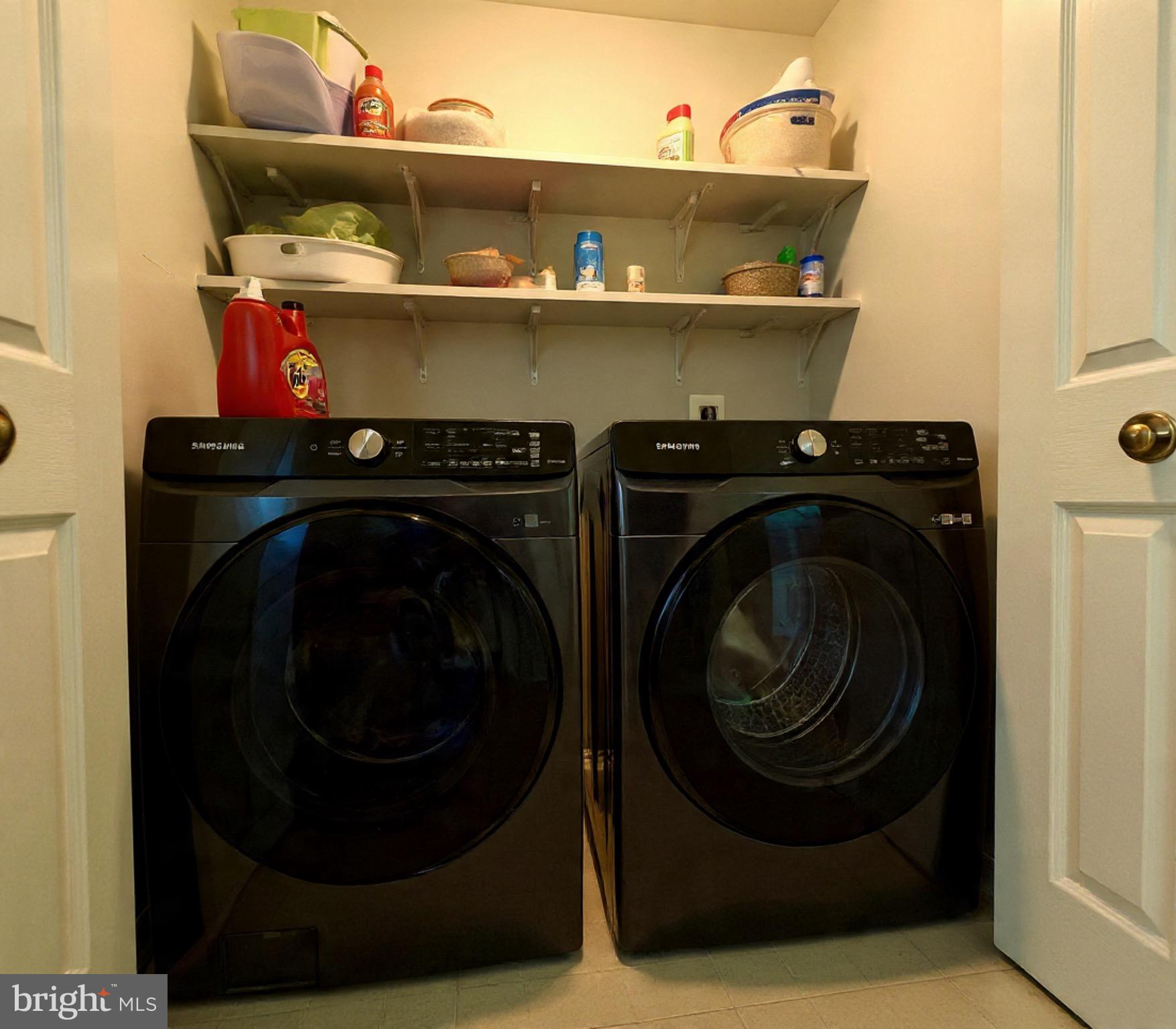 45460 Conductor Terrace, Unit 300 Sterling, VA 20166 - Photo 10 of 17 a utility room with dryer and washer